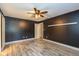 The light filled bedroom with vinyl plank flooring also features a ceiling fan at 12661 Doe Ln, Indianapolis, IN 46236