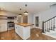 Bright kitchen featuring a wood island, stainless steel appliances, and subway tile backsplash at 12661 Doe Ln, Indianapolis, IN 46236