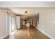 Open concept living area with hardwood floors leading to a kitchen with modern appliances at 12661 Doe Ln, Indianapolis, IN 46236