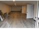 Unfinished basement with new flooring, white walls, and a view of storage space at 1267 W 750 S, Trafalgar, IN 46181