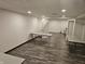 View of a basement area with light gray vinyl flooring and some tables setup at 1267 W 750 S, Trafalgar, IN 46181