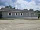 Light gray building with gray and white trim, with several regularly-spaced windows visible at 1267 W 750 S, Trafalgar, IN 46181