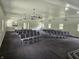 View of the interior meeting space with nice gray carpet and rows of chairs on each side of the room at 1267 W 750 S, Trafalgar, IN 46181