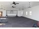 Expansive carpeted meeting room with modern lighting fixtures and bright white walls at 1267 W 750 S, Trafalgar, IN 46181