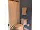 Bathroom with toilet, shower curtain, and a towel rack at 1273 Helford Ln, Carmel, IN 46032