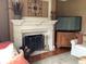 Inviting living room with fireplace and decorative mantle at 1273 Helford Ln, Carmel, IN 46032