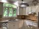 Modern kitchen with stainless steel appliances and granite countertops at 1273 Helford Ln, Carmel, IN 46032
