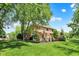 Expansive backyard featuring lush greenery, mature trees, and a patio area perfect for outdoor entertaining at 1377 Sedona Dr, Carmel, IN 46032