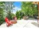 An expansive backyard patio featuring a cozy fire pit, comfortable seating, and lush greenery for outdoor enjoyment at 1377 Sedona Dr, Carmel, IN 46032