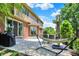 A luxurious backyard patio with a hammock, grill, and manicured lawn, perfect for outdoor relaxation and entertainment at 1377 Sedona Dr, Carmel, IN 46032