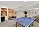 Finished basement area with ping pong table, kitchenette and dining, for relaxing and entertaining at 1377 Sedona Dr, Carmel, IN 46032