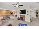Finished basement offering a recreational area with a ping pong table, television, and cozy seating at 1377 Sedona Dr, Carmel, IN 46032
