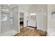 Open bathroom layout with a glass shower, tub, and a modern vanity at 1377 Sedona Dr, Carmel, IN 46032