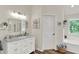 Charming bathroom featuring a vanity with a marble top, and ample natural light at 1377 Sedona Dr, Carmel, IN 46032