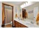 Bathroom featuring a double sink vanity with a large mirror and neutral color scheme at 1377 Sedona Dr, Carmel, IN 46032