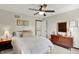 Bedroom with natural light, ceiling fan, carpeted floor, comfortable bed, and a classic wood dresser at 1377 Sedona Dr, Carmel, IN 46032