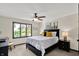 Well-lit bedroom featuring a comfortable bed with decorative pillows and a large window offering a pleasant view at 1377 Sedona Dr, Carmel, IN 46032