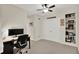 Bedroom with built-in shelving, closet, and desk space, perfect for work or study at 1377 Sedona Dr, Carmel, IN 46032
