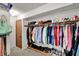Walk-in closet featuring an efficient storage system with rods and shelves for organized clothing and shoe display at 1377 Sedona Dr, Carmel, IN 46032