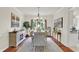 Elegant dining room with wood floors, crown molding, and an eye-catching chandelier at 1377 Sedona Dr, Carmel, IN 46032