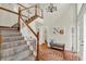 Grand foyer with a staircase, chandelier, and decorative accents create an elegant entrance at 1377 Sedona Dr, Carmel, IN 46032