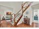 Inviting foyer with hardwood floors, staircase, and a view of the living room, offering a warm welcome at 1377 Sedona Dr, Carmel, IN 46032