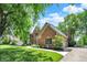 A charming brick home with well-maintained landscaping, stone walkway and manicured lawn at 1377 Sedona Dr, Carmel, IN 46032