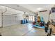A clean garage offering plenty of open space for parking and storage, featuring durable flooring and ample lighting at 1377 Sedona Dr, Carmel, IN 46032