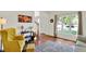 Bright living room featuring hardwood floors, a decorative rug, and a sunny window view at 1377 Sedona Dr, Carmel, IN 46032