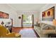 Bright living room featuring hardwood floors, large windows, and neutral paint colors at 1377 Sedona Dr, Carmel, IN 46032
