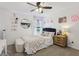 Bright bedroom with accent lighting, a comfy bed with throw pillows, and a decorative shelf at 1414 W Springhurst Blvd, Greenfield, IN 46140