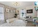bedroom featuring a platform bed, accent wall, and cozy decor at 1414 W Springhurst Blvd, Greenfield, IN 46140