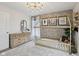 bedroom with decorative lighting, a light fixture, and accent wall at 1414 W Springhurst Blvd, Greenfield, IN 46140