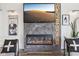 Modern fireplace with a textured surround, showcasing contemporary design and providing a cozy focal point at 1414 W Springhurst Blvd, Greenfield, IN 46140