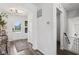 Bright foyer with hardwood flooring, white walls, and view of front door, creating a welcoming entrance at 1414 W Springhurst Blvd, Greenfield, IN 46140