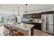 Kitchen featuring granite countertops, stainless steel appliances, and a breakfast bar at 1414 W Springhurst Blvd, Greenfield, IN 46140