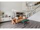 Open-concept living area flowing into the dining area, creating a spacious and inviting atmosphere with vinyl floors at 1414 W Springhurst Blvd, Greenfield, IN 46140