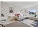 Stylish living room with a decorative accent wall, plush sectional sofa, and fun, playful decor at 1414 W Springhurst Blvd, Greenfield, IN 46140