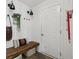Welcoming mudroom with a bench, coat hooks, and stylish decor at 1414 W Springhurst Blvd, Greenfield, IN 46140