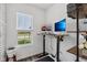 Bright home office space with a standing desk and natural light at 1414 W Springhurst Blvd, Greenfield, IN 46140