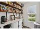 Pantry with open shelving and white cabinets providing ample storage at 1414 W Springhurst Blvd, Greenfield, IN 46140