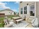 Outdoor patio featuring a cozy seating area with a fire pit, perfect for relaxing and entertaining at 1414 W Springhurst Blvd, Greenfield, IN 46140