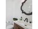 Modern powder room featuring a decorative mirror and stylish vanity at 1414 W Springhurst Blvd, Greenfield, IN 46140