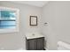 This bathroom features a vanity, a window for natural light, and a toilet at 1418 W 5Th St, Anderson, IN 46016