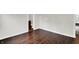 An open door reveals a hallway with an empty bathroom at the end at 1418 W 5Th St, Anderson, IN 46016