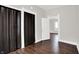 A hallway shows an open doorway, a bedroom, and brown folding closet doors at 1418 W 5Th St, Anderson, IN 46016