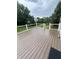 Back deck with a view of backyard, constructed with composite planks and a black metal railing at 14375 Leland Muse, Fishers, IN 46037