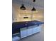 Finished basement bar with a sleek countertop and modern pendant lighting creating a cozy atmosphere at 14375 Leland Muse, Fishers, IN 46037