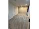 Finished basement area with neutral walls and carpet, offering a versatile space for various uses at 14375 Leland Muse, Fishers, IN 46037