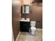 Bathroom featuring a modern vanity, toilet, and neutral tile, complemented by warm wall color at 14375 Leland Muse, Fishers, IN 46037